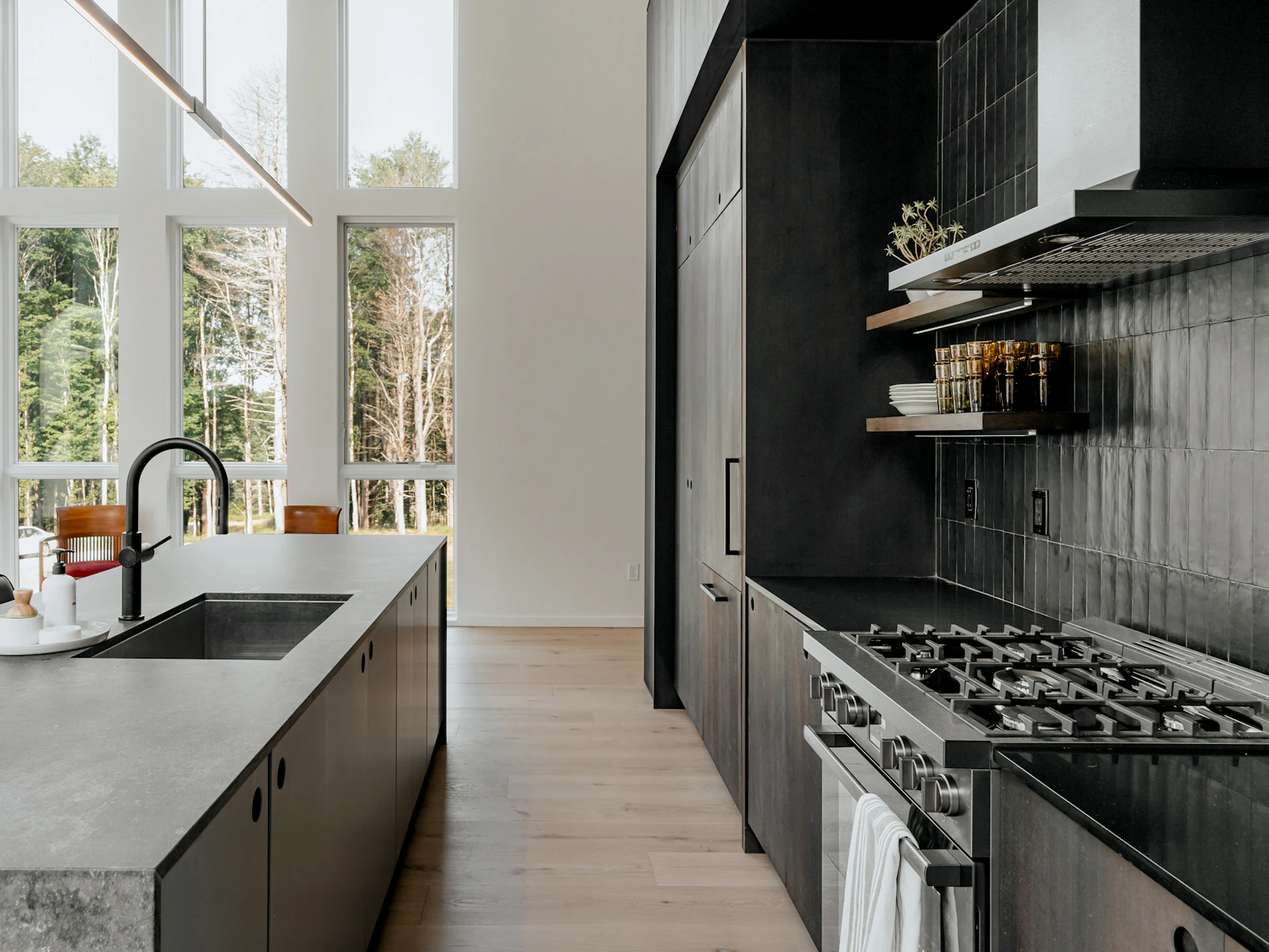 Illustrative photo of a bright kitchen with a cooktop beside a window