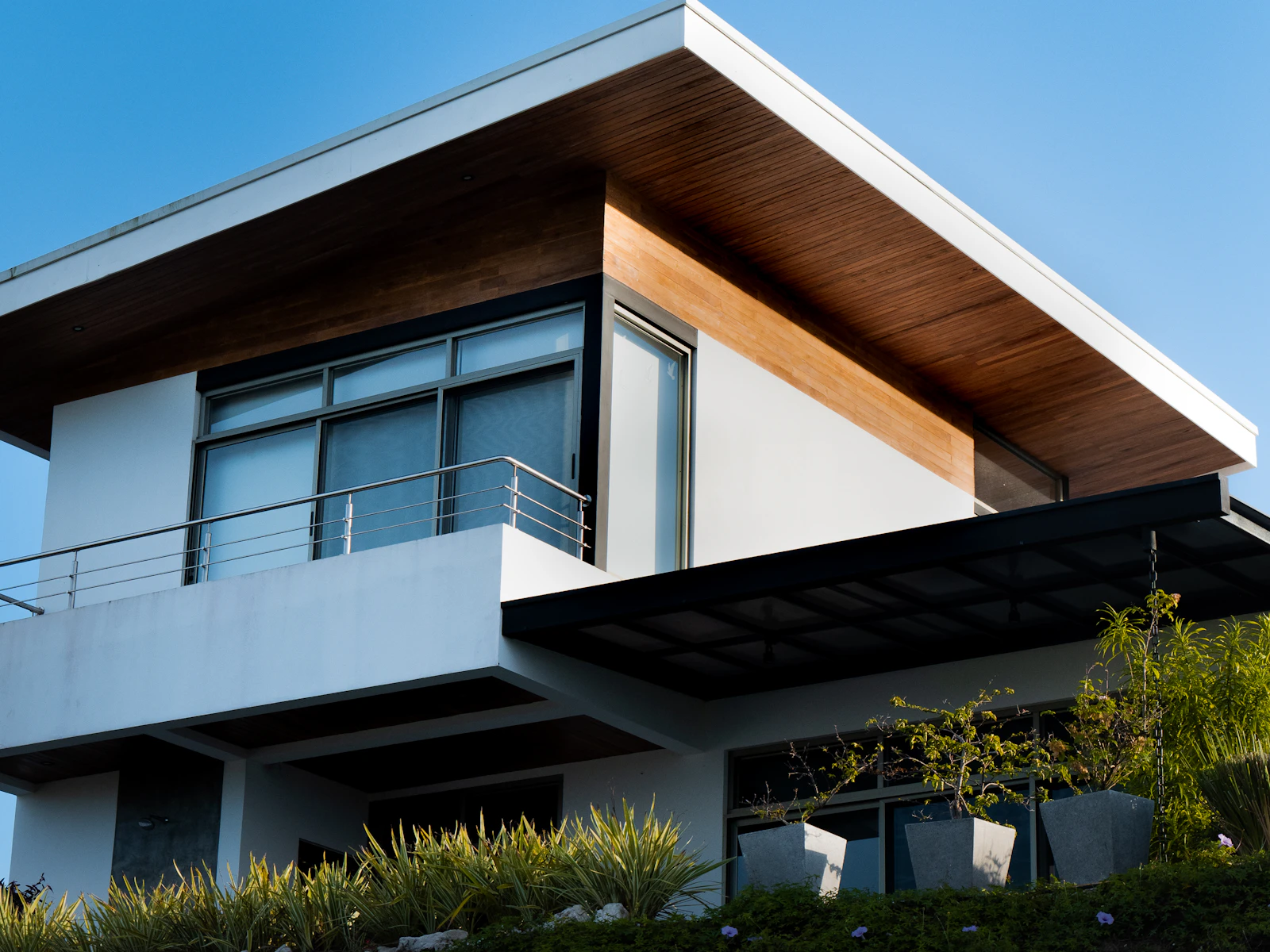Illustrative photo of a house with a balcony and a balcony railing