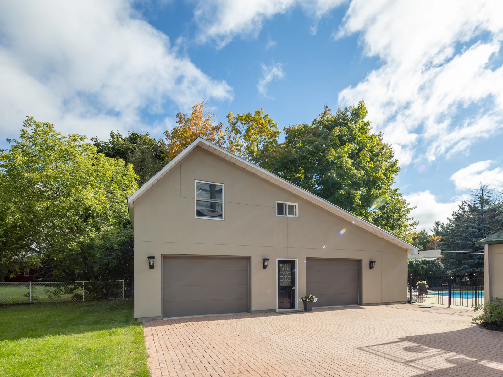 Illustrative photo of a house with a pool in the back yard
