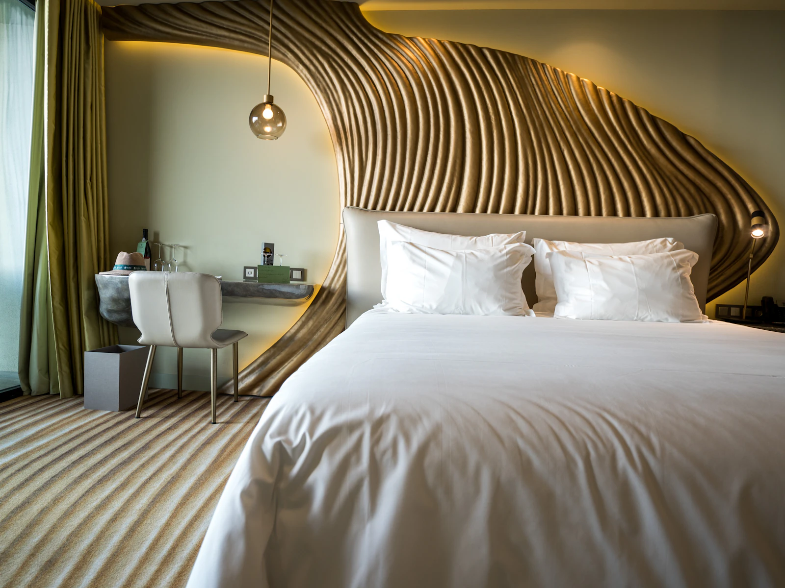 Illustrative photo of a bedroom with a white bed and a wooden headboard