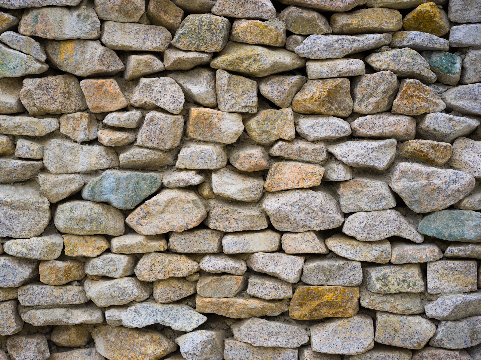 Illustrative photo of a stone wall made up of rocks and gravel