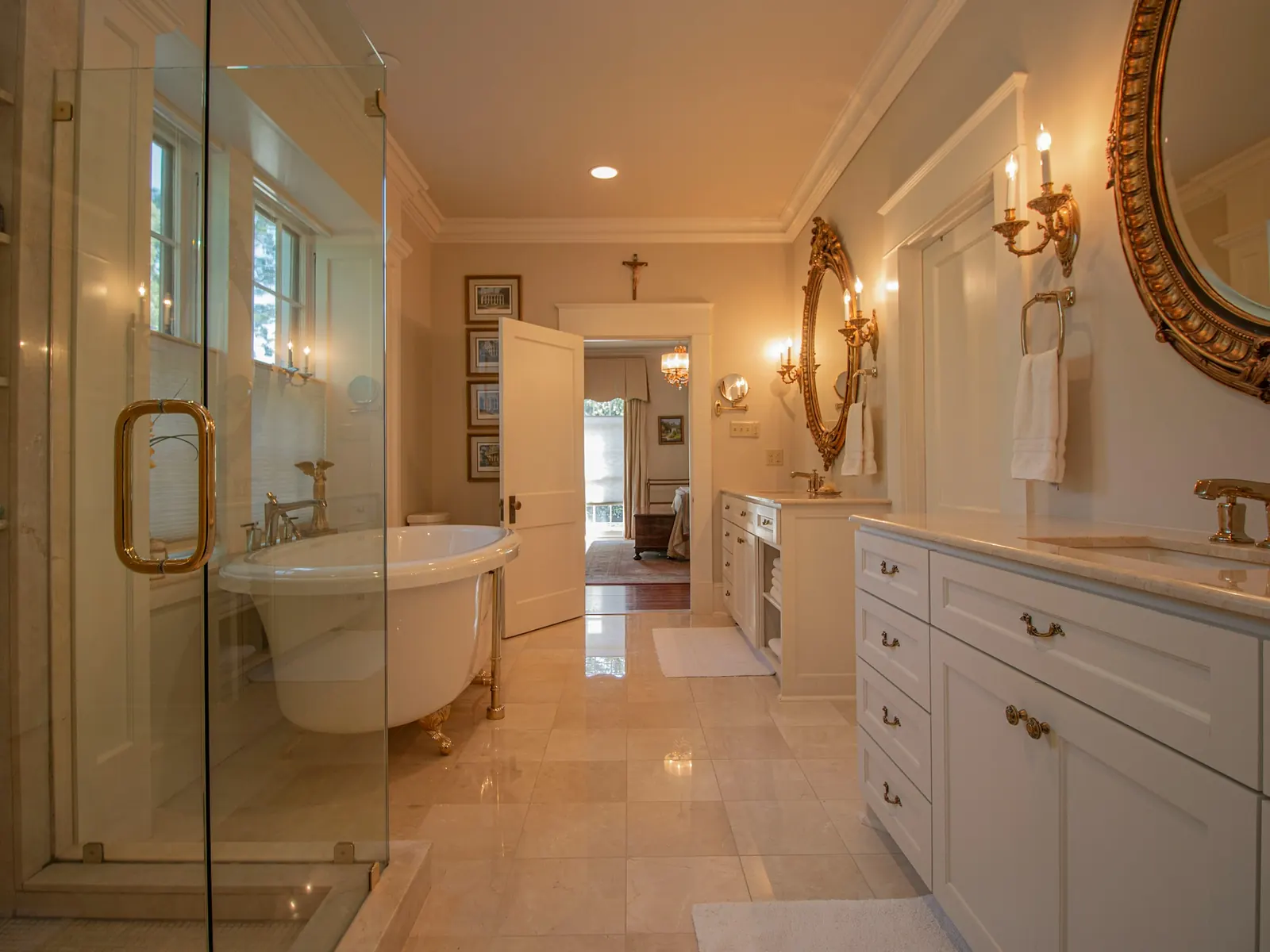 Illustrative photo of a marble bathroom with a glass shower and freestanding tub