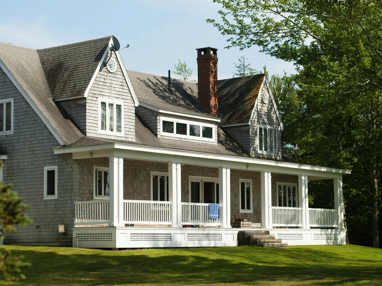 Illustrative photo of a wraparound porch with warm evening light